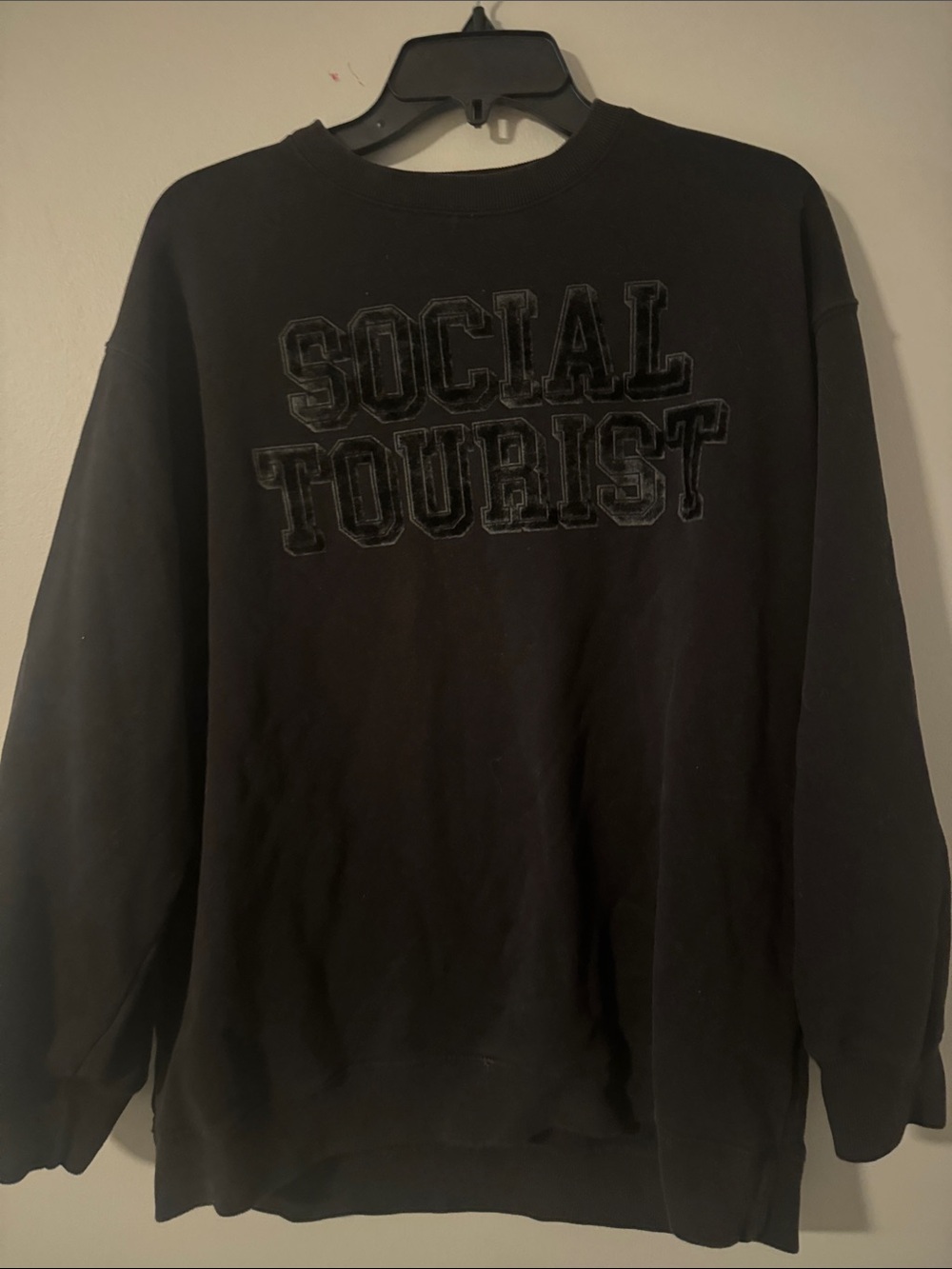 Black Crewneck Sweatshirt with 'Social Tourist' Embossed Logo